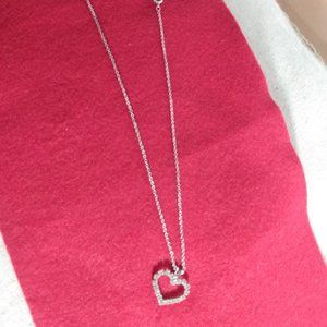 Silver tone open heart chain necklace.